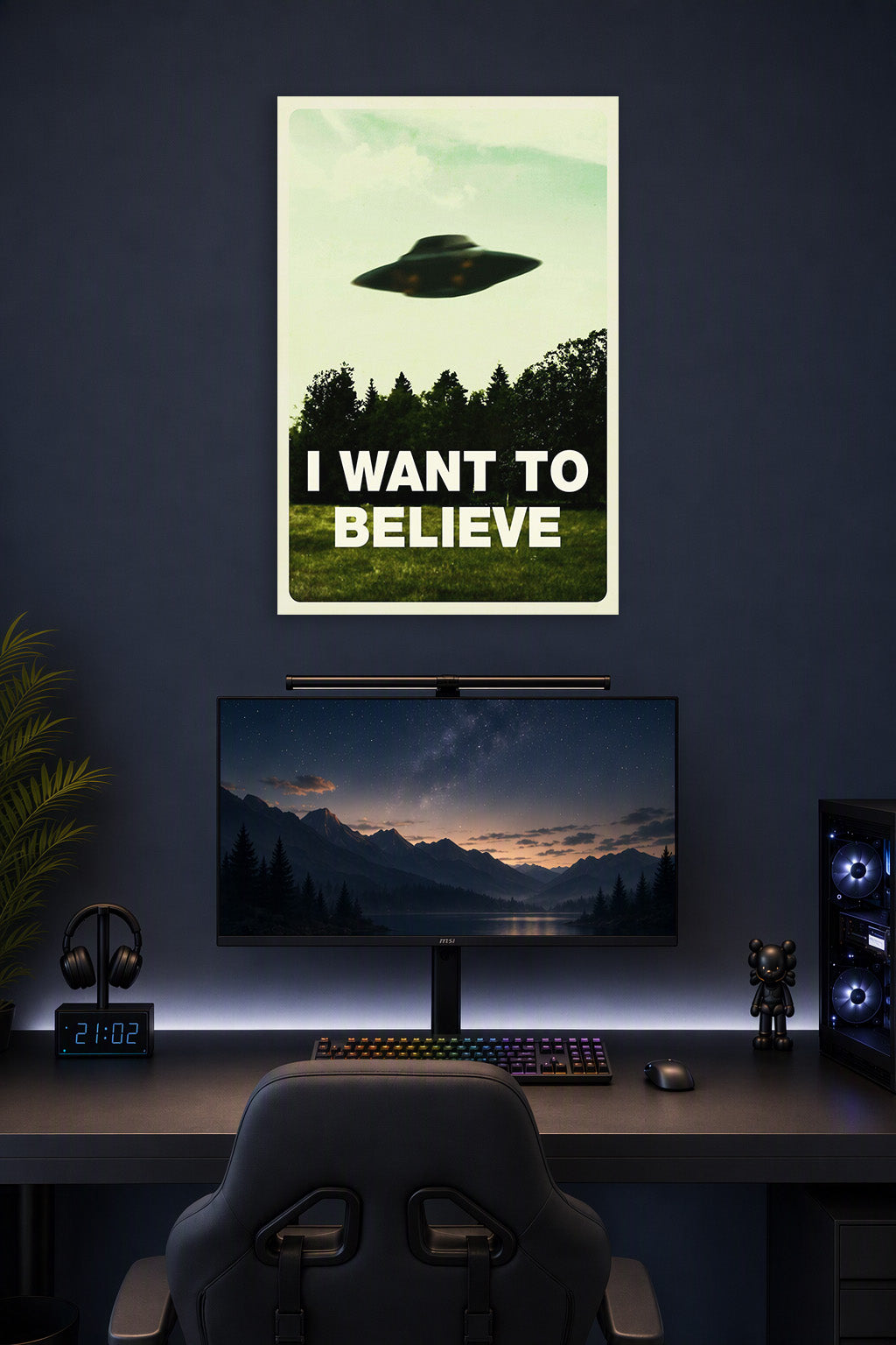 X-Files 'I Want To Believe' UFO in a gaming desk setup above a monitor.
