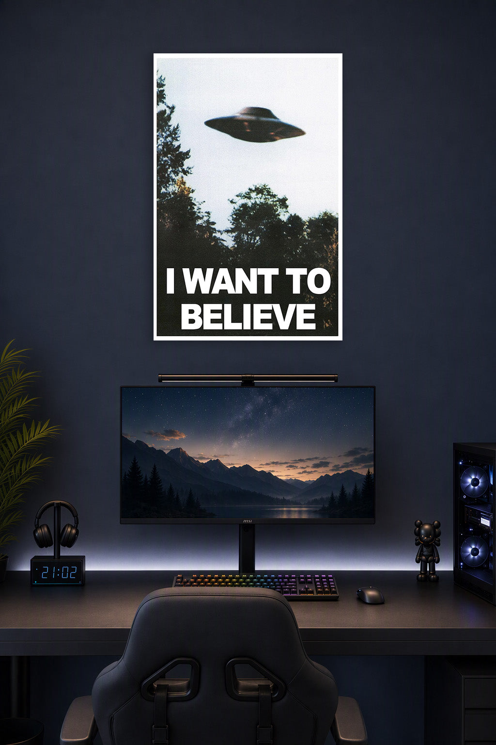 X-Files UFO I Want To Believe in a gaming desk setup above a monitor.