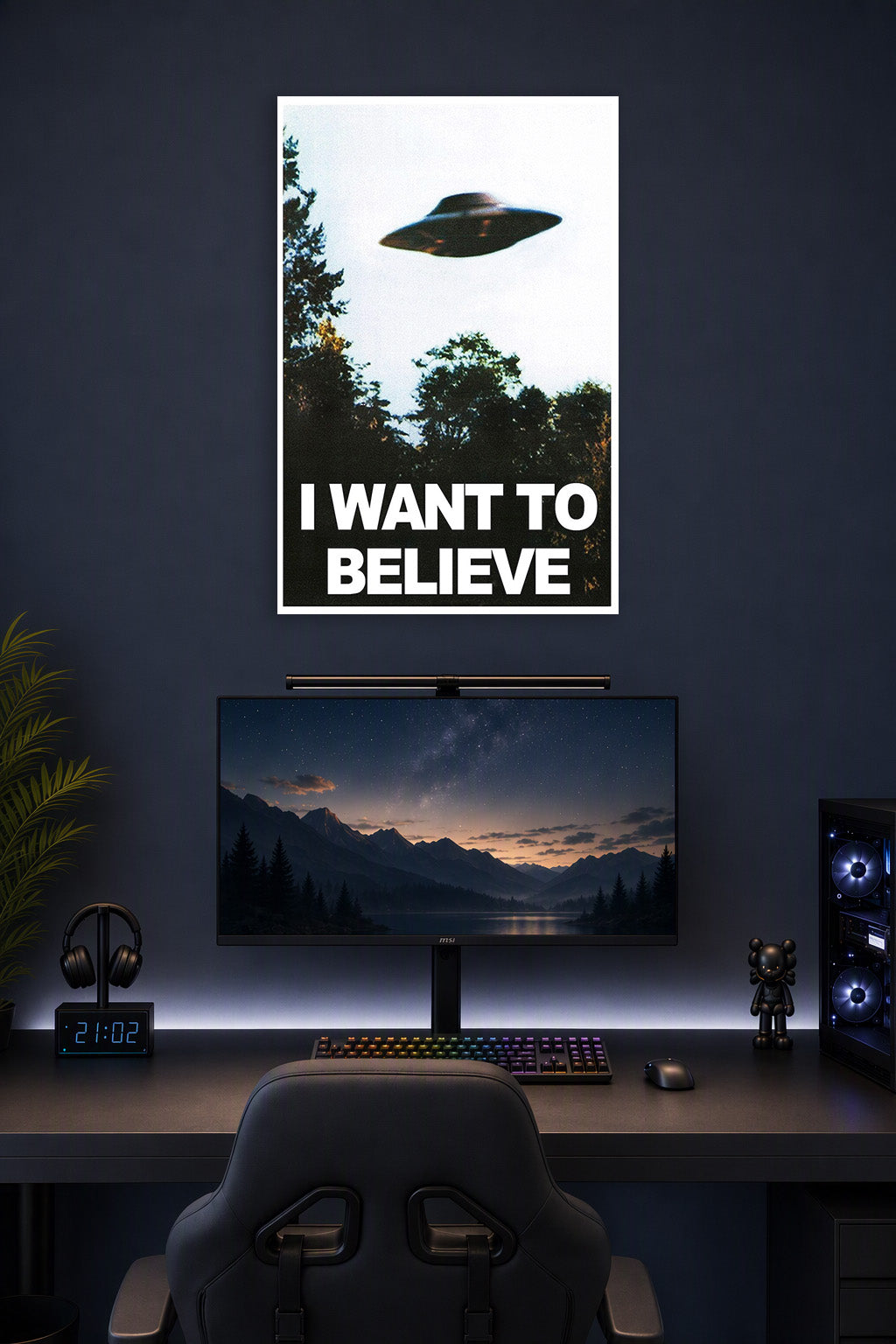 X-Files UFO 'I Want to Believe' in a gaming desk setup above a monitor.
