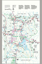 Yellowstone National Park wall art print displays a detailed road map with blue waterways, red routes, green boundaries, and visitor icons.