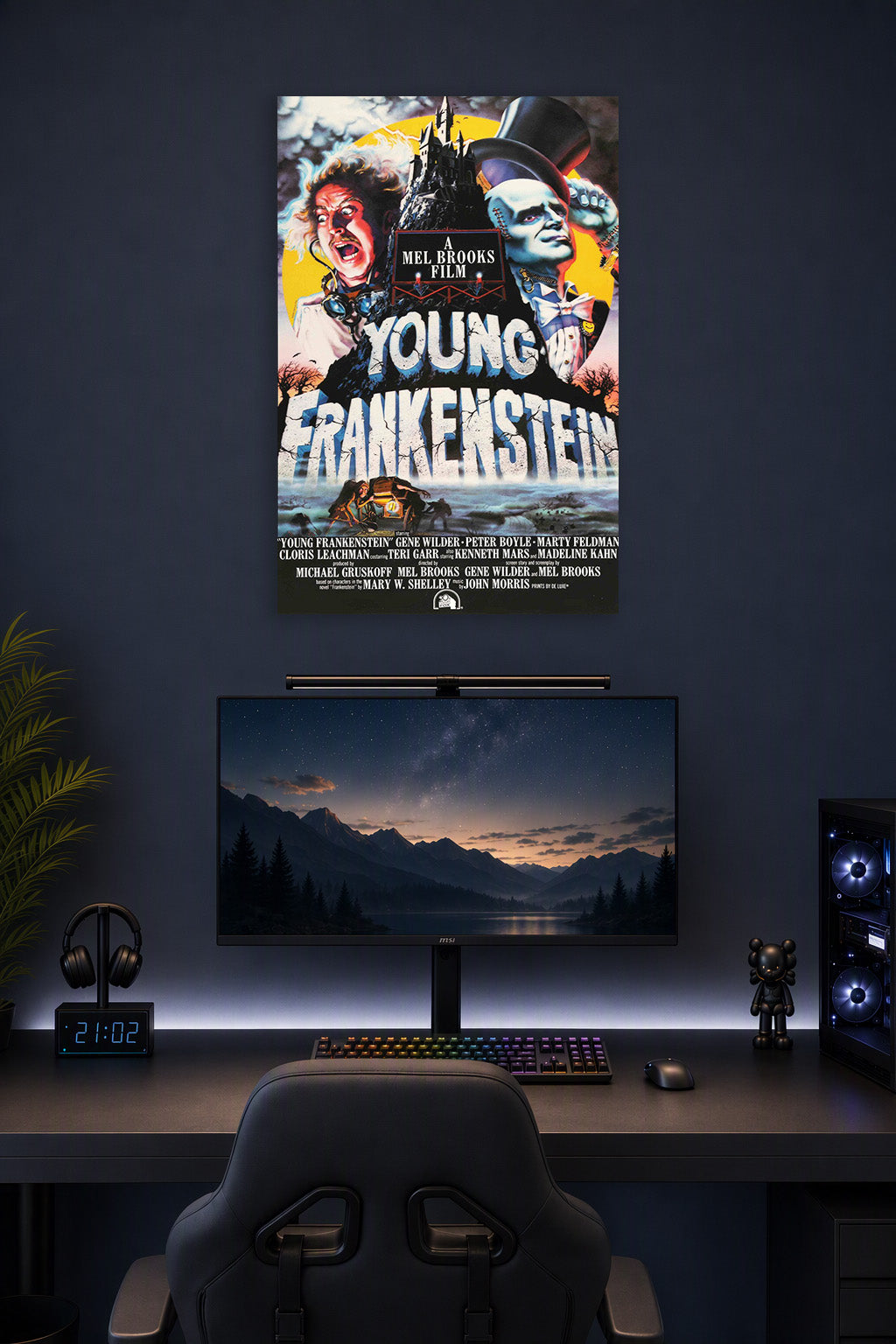 Young Frankenstein in a gaming desk setup above a monitor.
