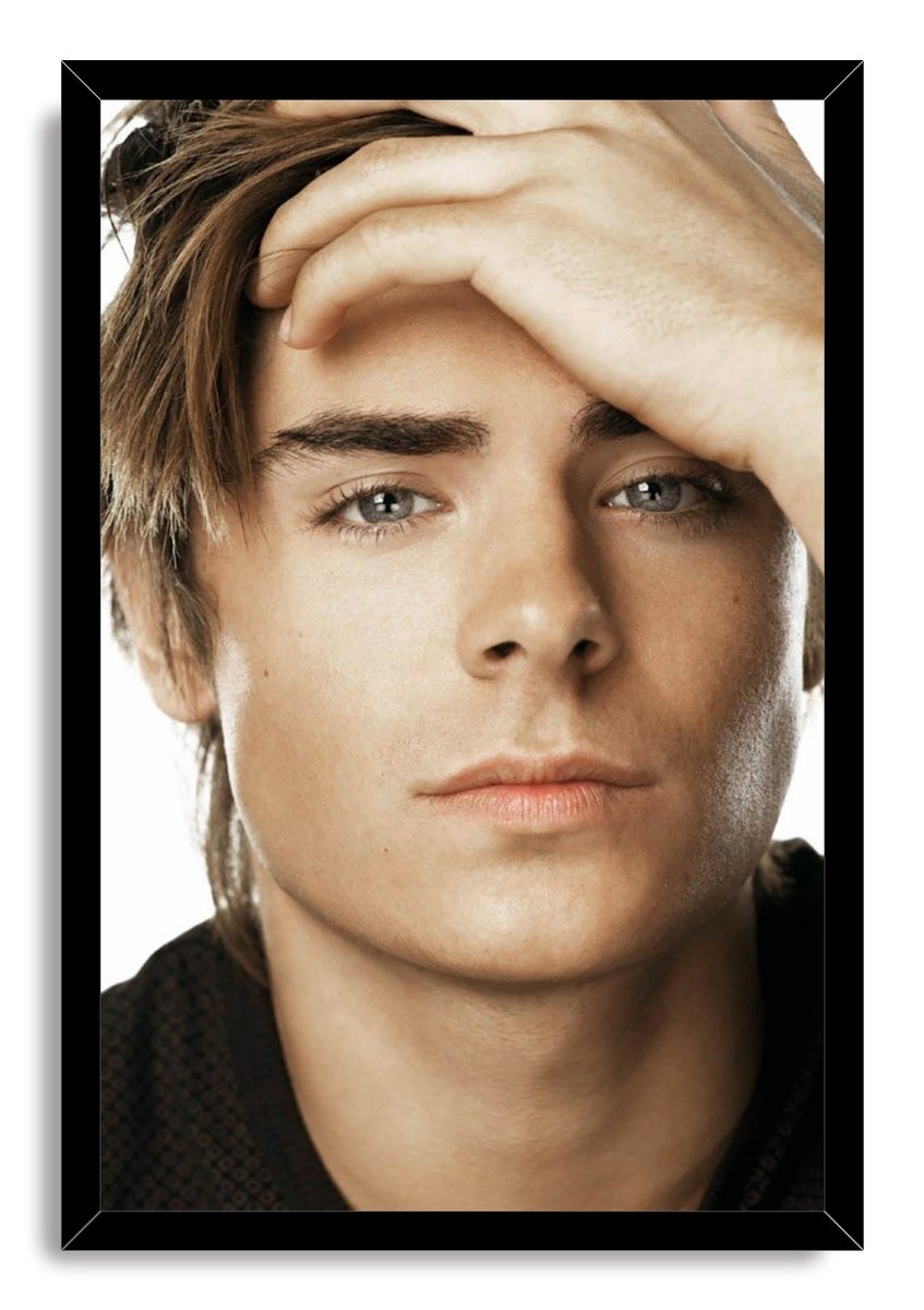 Zac Efron framed wall art print with a black border, featuring his close-up portrait and hand across his forehead.