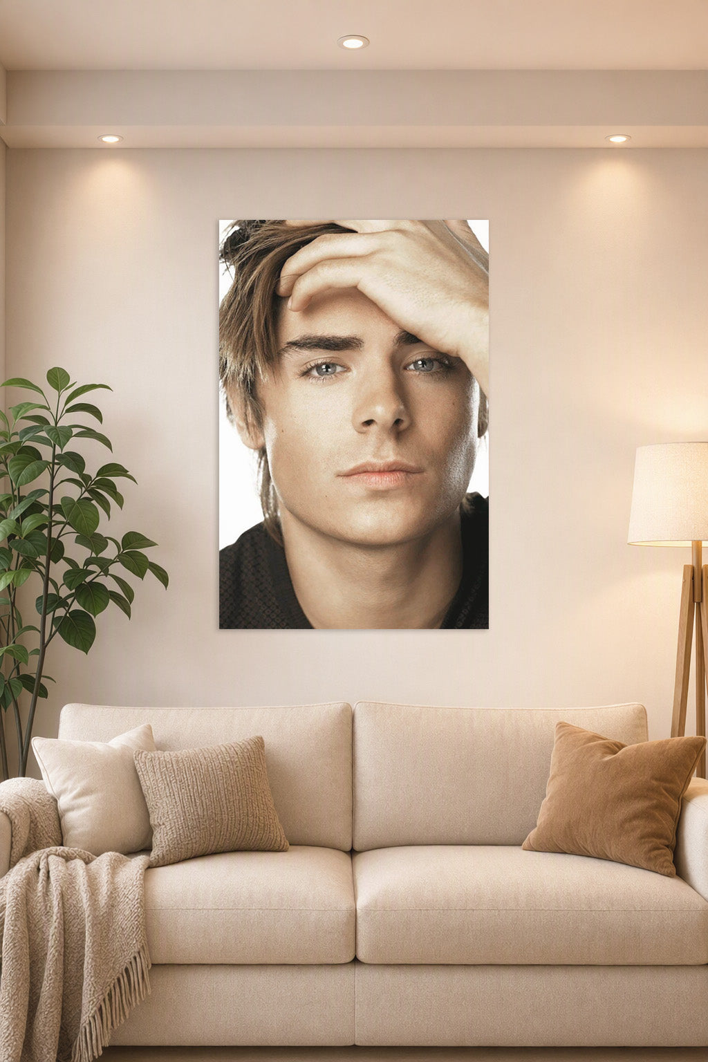 Zac Efron in a bright living room above a beige sofa.