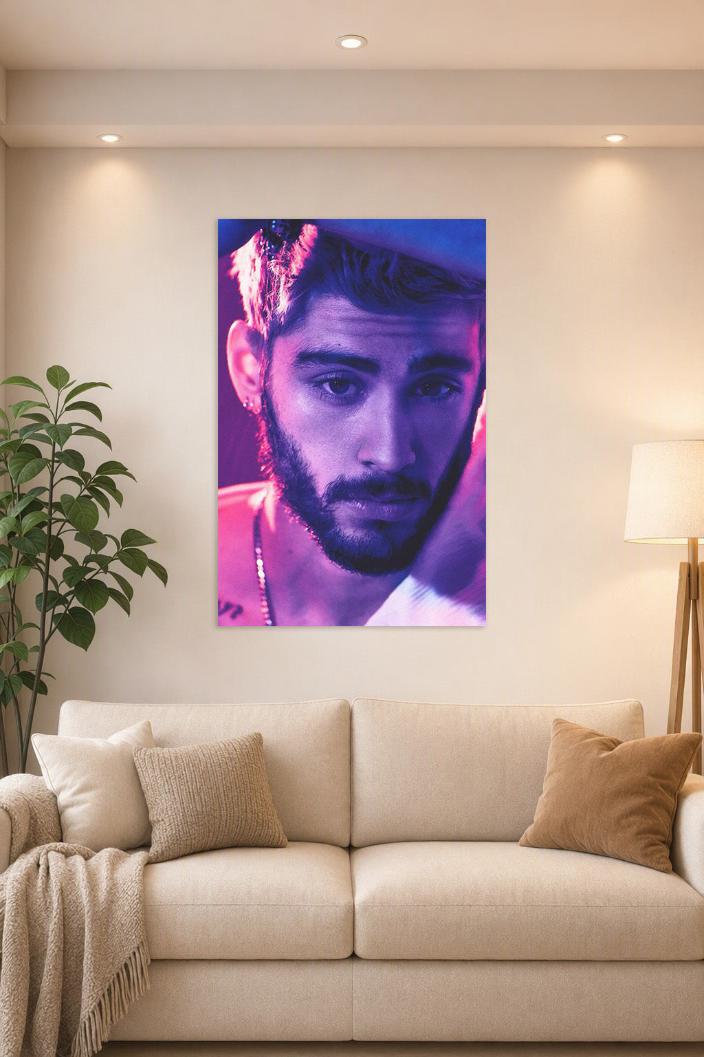 Zayn Malik in a bright living room above a beige sofa.