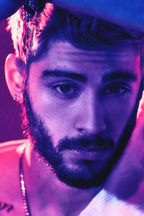 Zayn Malik wall art print with a close-up bearded portrait in vivid purple, blue, and pink neon lighting.