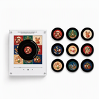 White NFC magnetic player with nine black-rimmed Cute Anime Christmas discs featuring chibi festive characters, trees, reindeer, snowman, snowy house, cookies, and gifts.