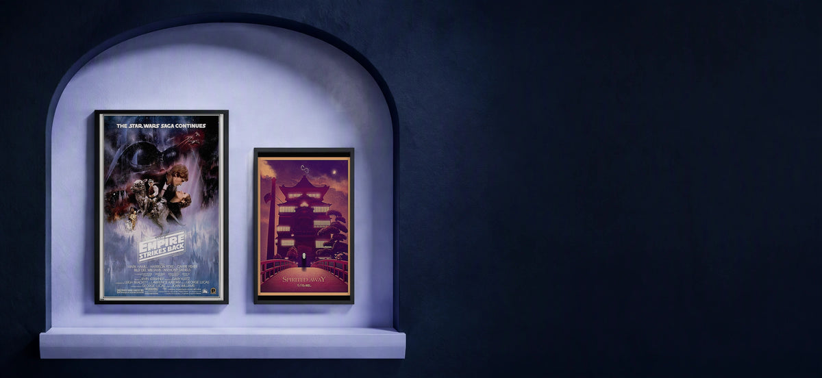 Star Wars and Spirited Away posters in a lavender arched gallery on a midnight navy wall.